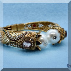 J42. Goldtone bangle bracelet w/faux pearl end pieces - $6